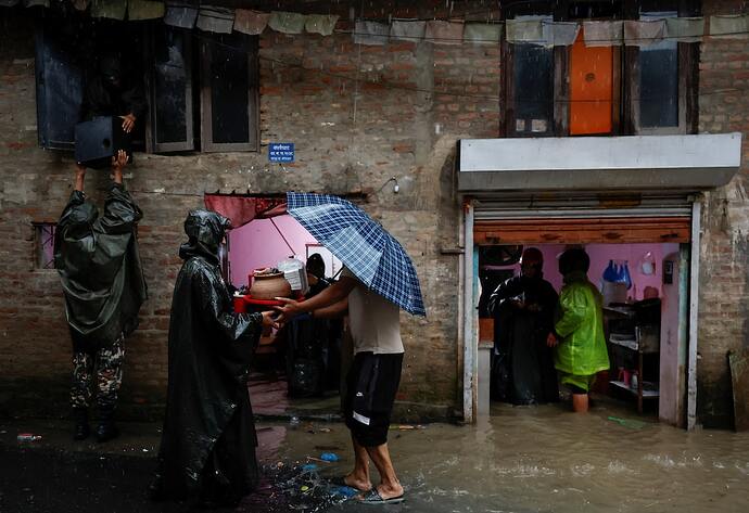 Nepal Army assists residents during flooding along the Bagmati River in Kathmandu