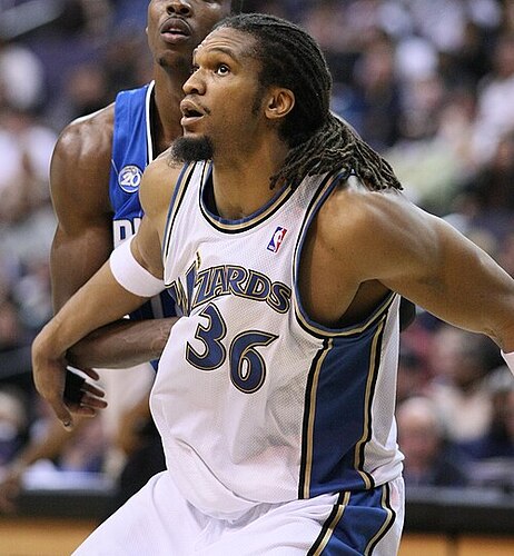 Etan Thomas, former NBA center, recognized for defensive presence and advocacy.