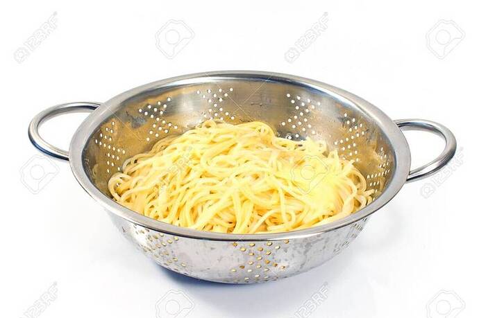 32758570-fresh-cooked-spaghetti-in-stainless-strainer-isolated-on-white