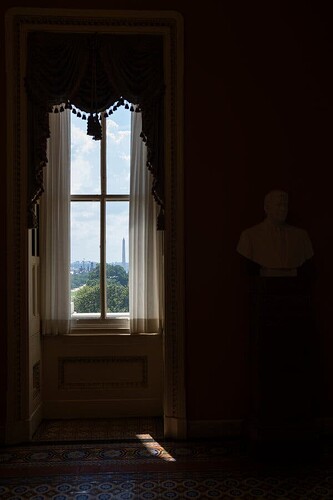 A view of the Washington Monument through a window on Capitol Hill.