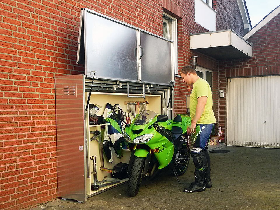 http://theawesomer.com/photos/2014/10/retractable_motorcycle_shed_6.jpg
