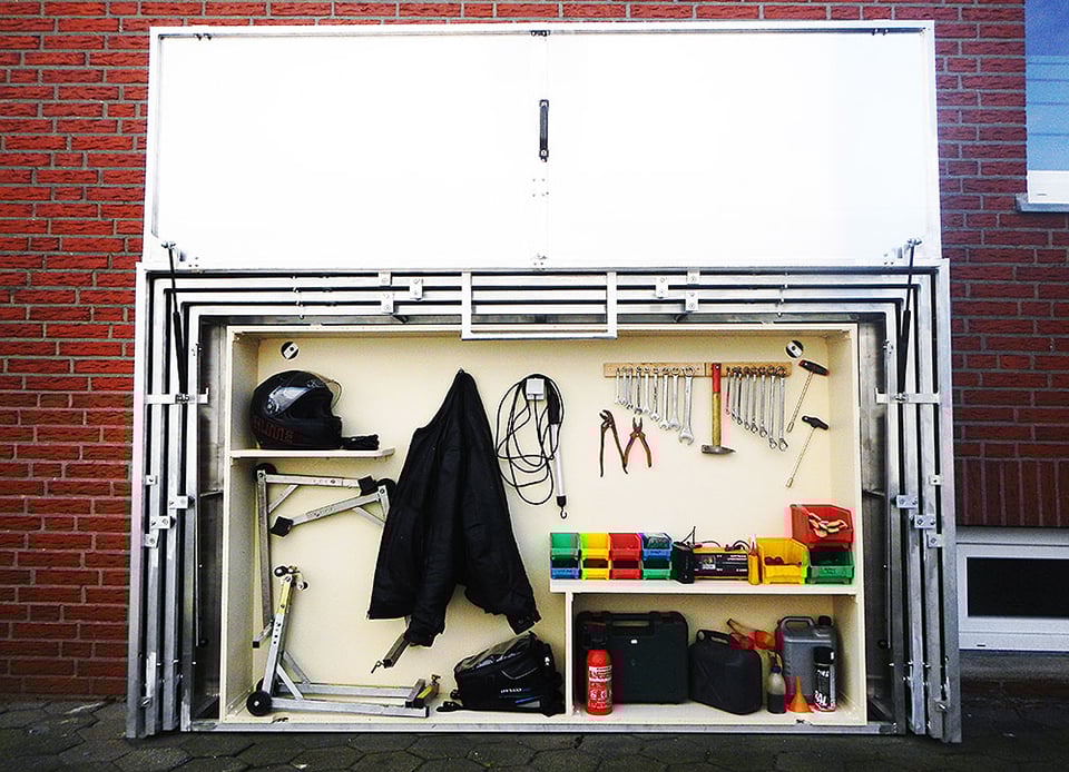 http://theawesomer.com/photos/2014/10/retractable_motorcycle_shed_4.jpg