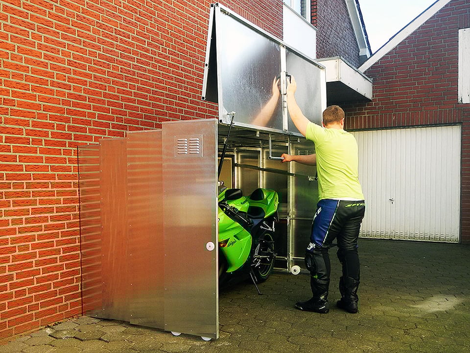 http://theawesomer.com/photos/2014/10/retractable_motorcycle_shed_7.jpg