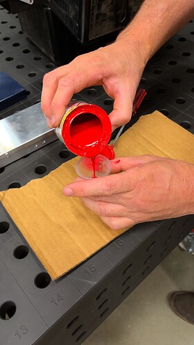 Pouring The Paint In The Small Plastic Cup