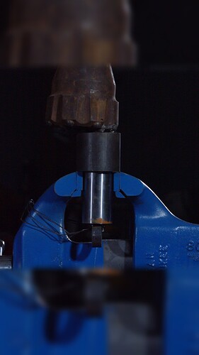 A Vise Cracking Once It Has been Hammered Down Breaking The Jaws Underneath